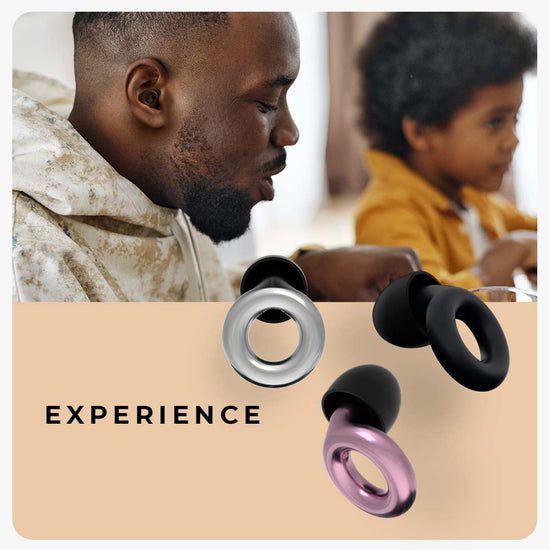Image of a man and a toddler. The man is wearing Loop Experience earplugs.